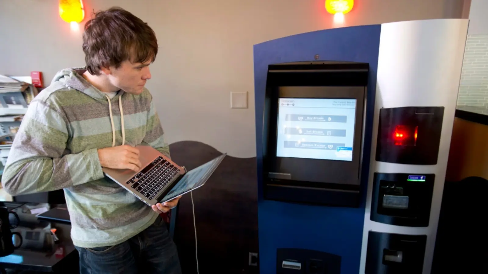 A photo of the Bitcoin event: The first Bitcoin ATM was installed in the Waves Coffee Shop, Vancouver, Canada