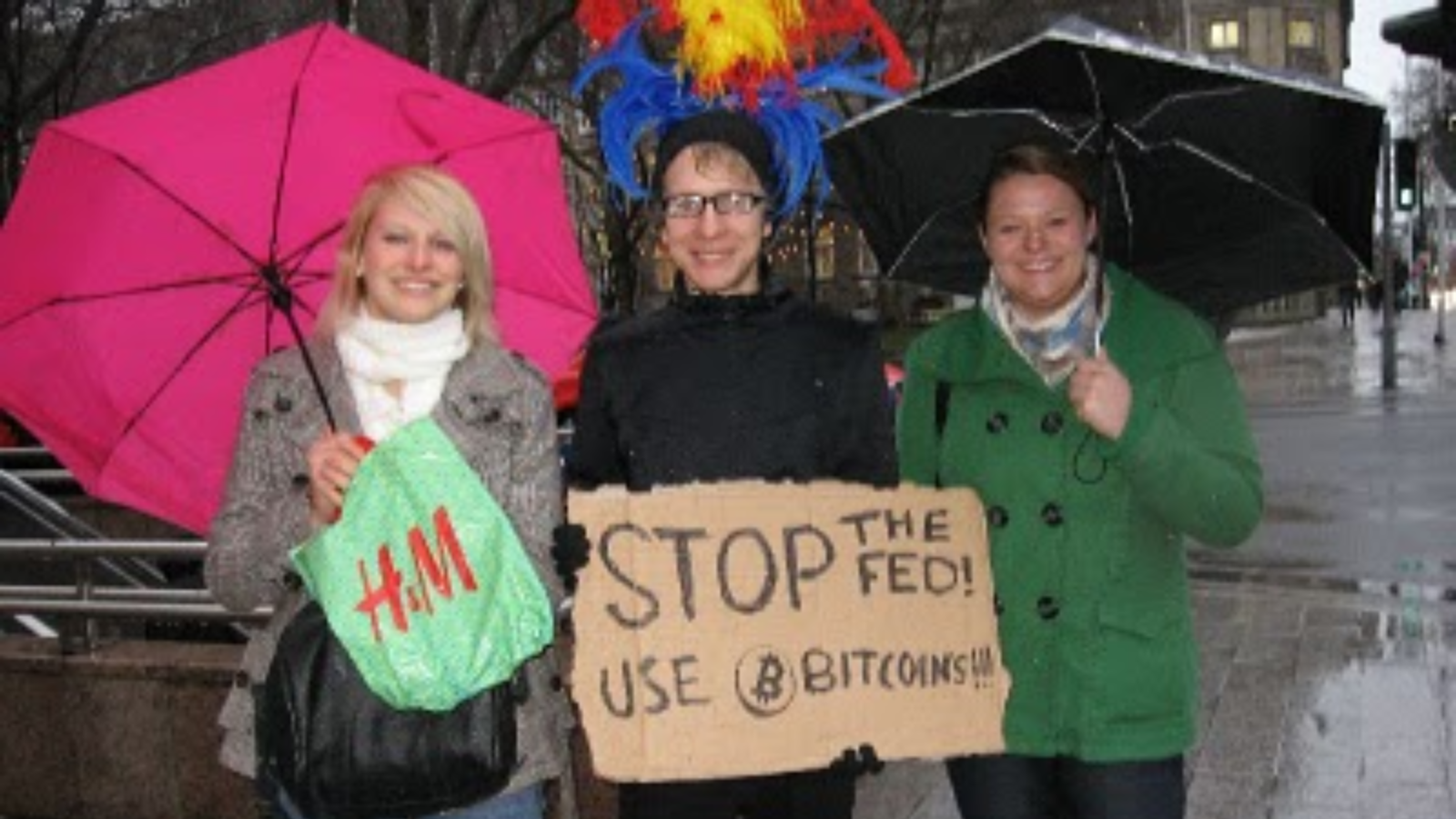 A photo representation of the Bitcoin event, Guy dresses up in funny outfit and a Bitcoin sign for a 32 BTC reward