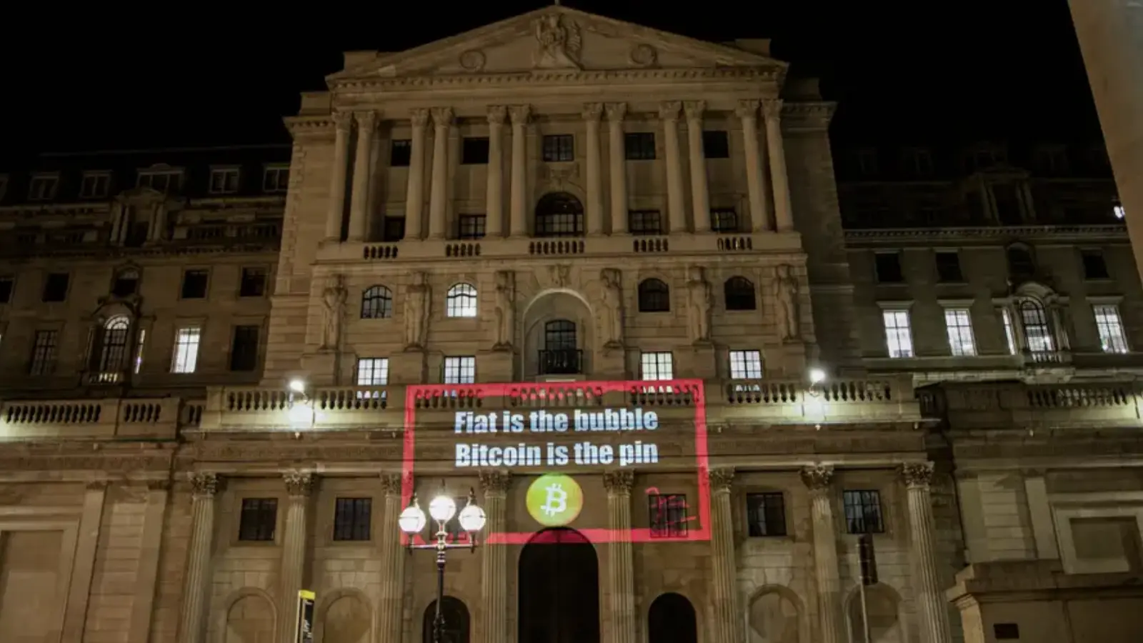 A photo representation of the Bitcoin event, Bitcoin and related slogans were projected onto the building of the Bank Of England